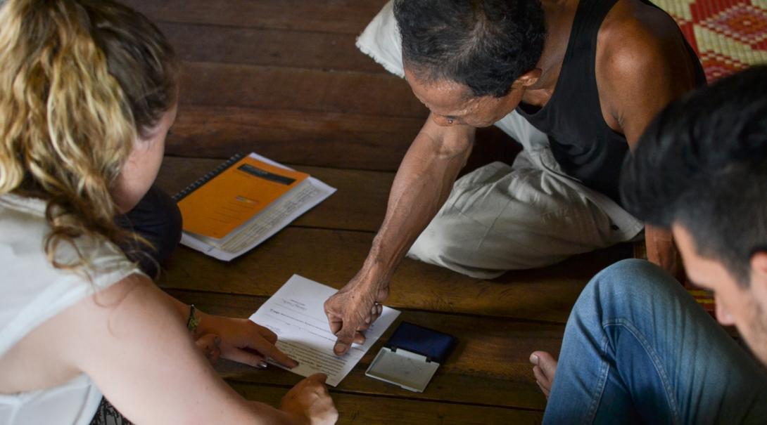 A Projects Abroad intern gains Micro-finance work experience collecting loan repayments. A local entrepreneur receives a loan on one of our Micro-finance internships abroad.